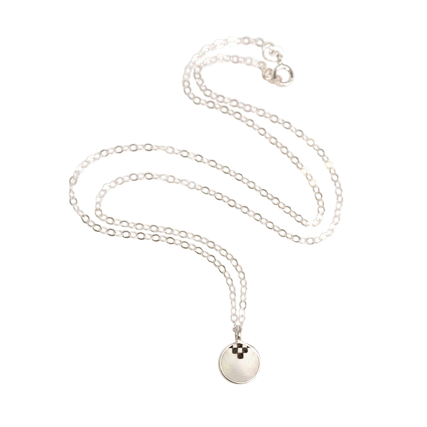 little round full moon pendant, in engraved mother of pearl & sterling silver, on fine sterling silver chain, with black checquerboard motif.