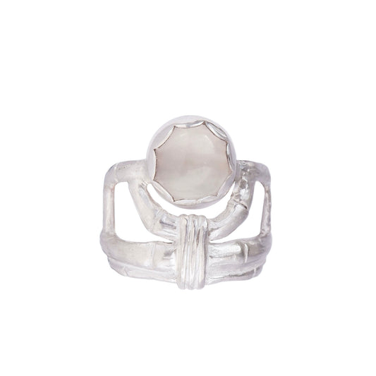 structural open-work ring in a bamboo style, featuring a smooth round misty grey moonstone gemstone in a scalloped setting. Sterling Silver. white background