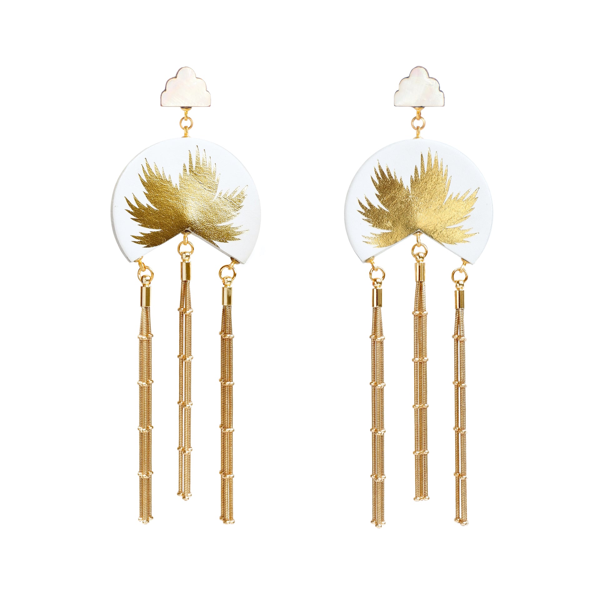 white leather medallion earrings, with gold palm tree print, gold tassels & mother of pearl cloud shade studs.