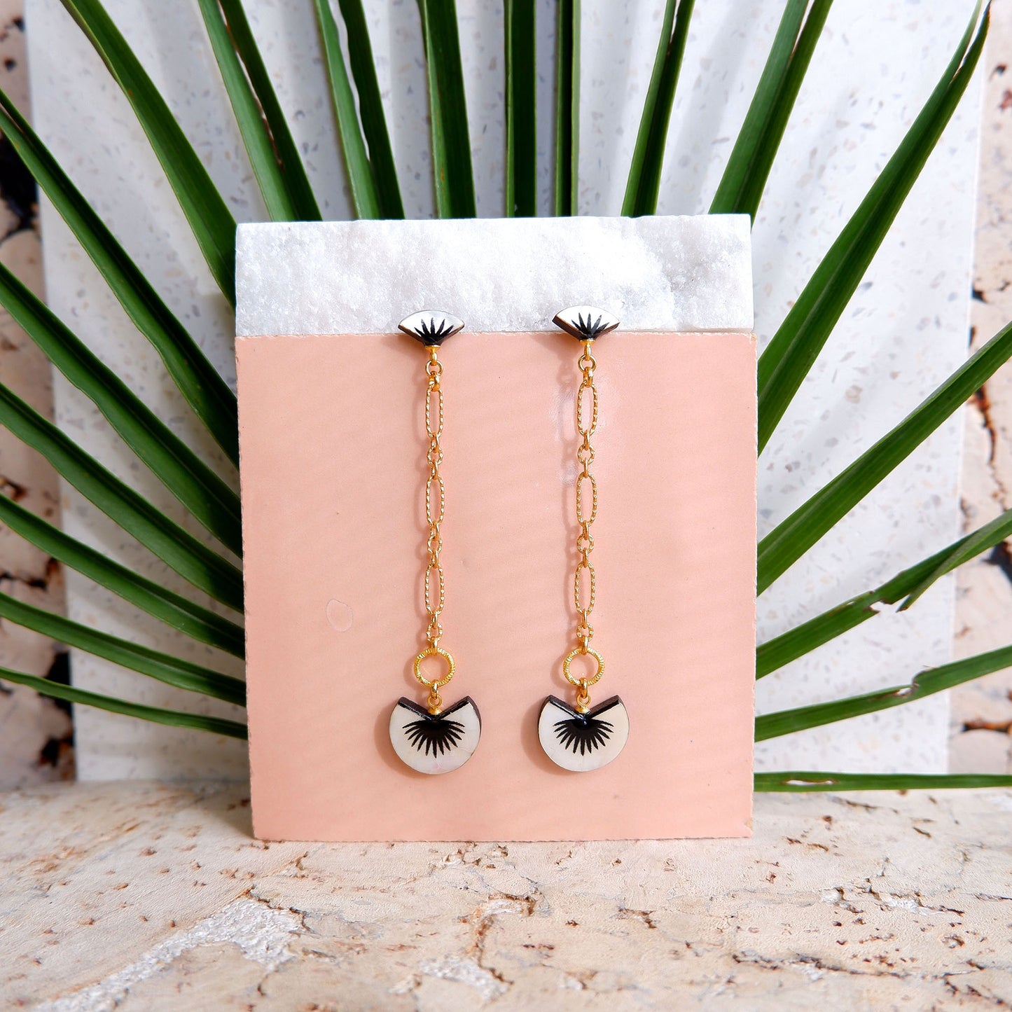 graphic palm print black & mother of pearl drop earrings with golden chain, pink tile