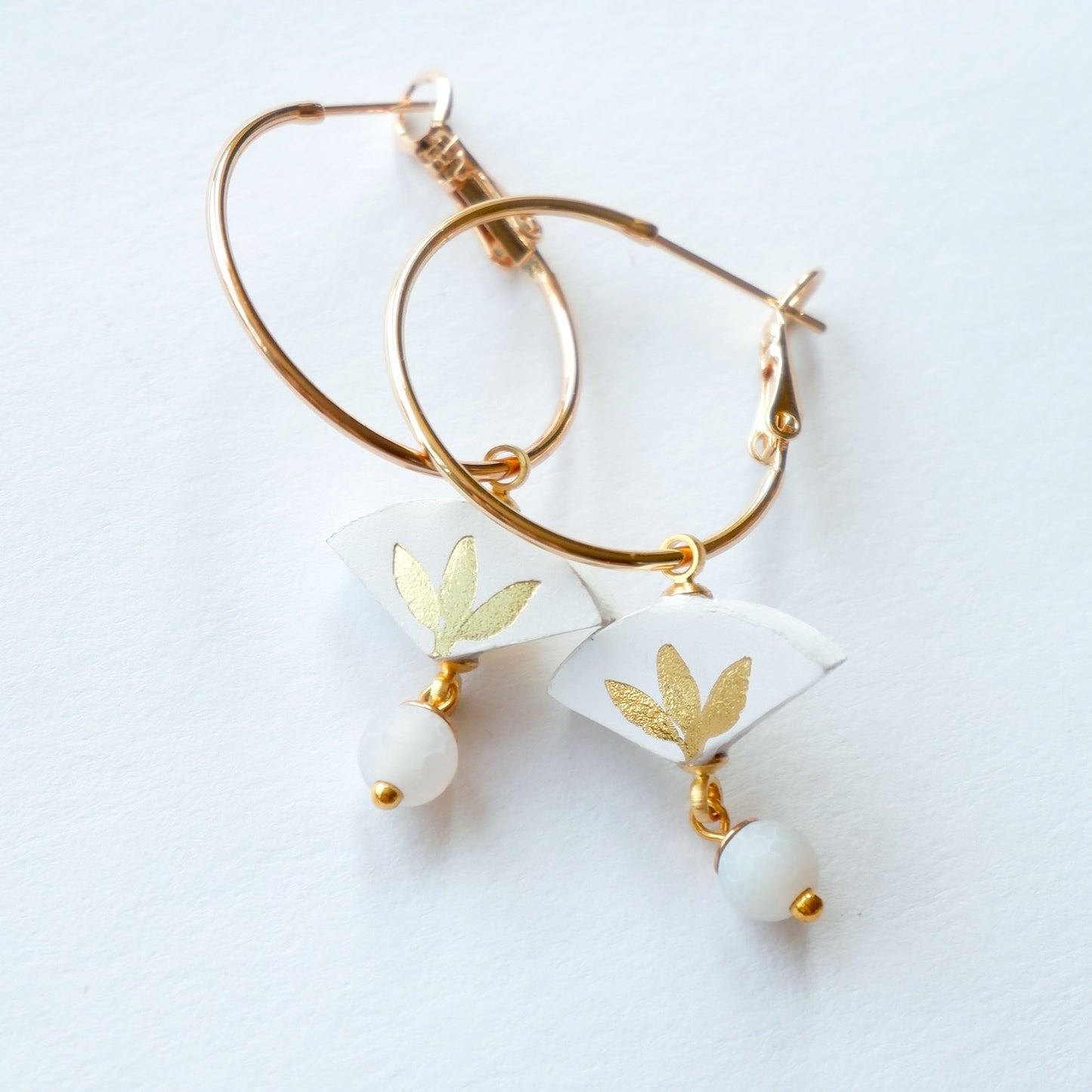white & gold palm print leather gold hoop earrings with white bead