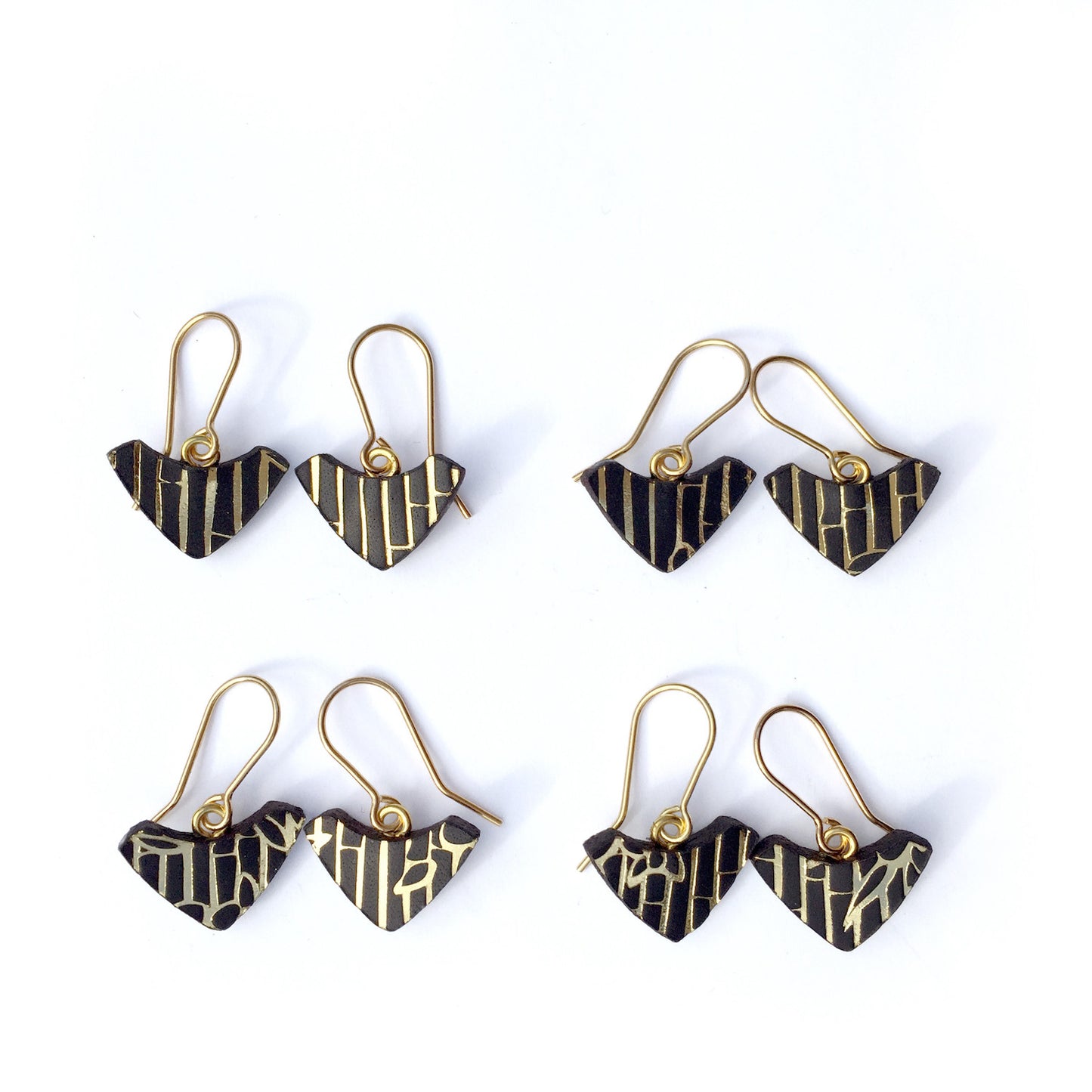 PRINTED LEATHER ARC . hook earrings