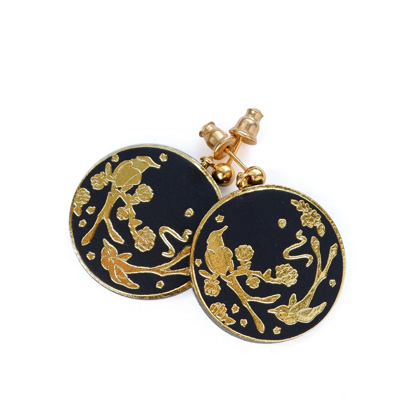 Black leather coin earrings, embossed with illustrations of birds in gold