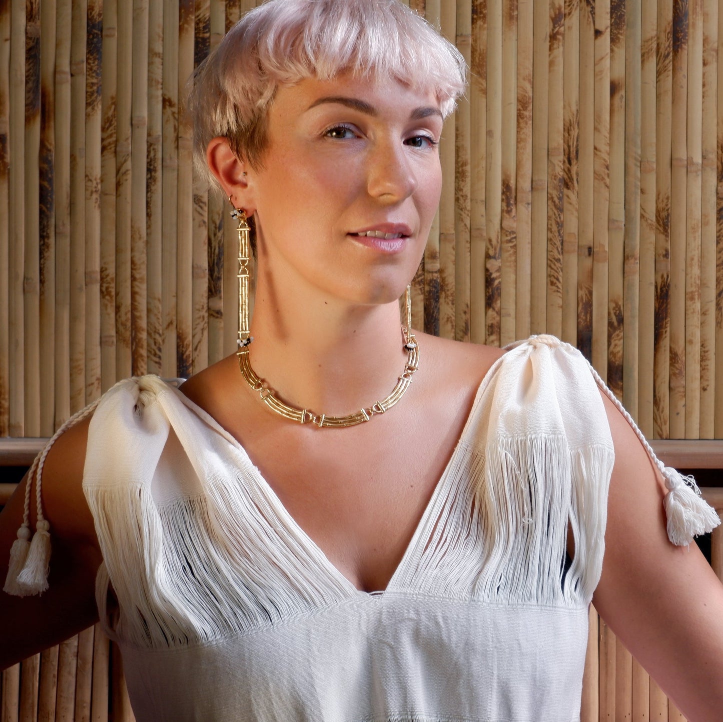 Gold Vermeil Bamboo Bar cocktail necklace & Earrings on model, bamboo backdrop