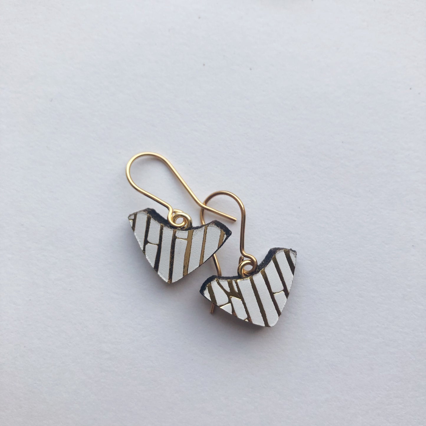 PRINTED LEATHER ARC . hook earrings