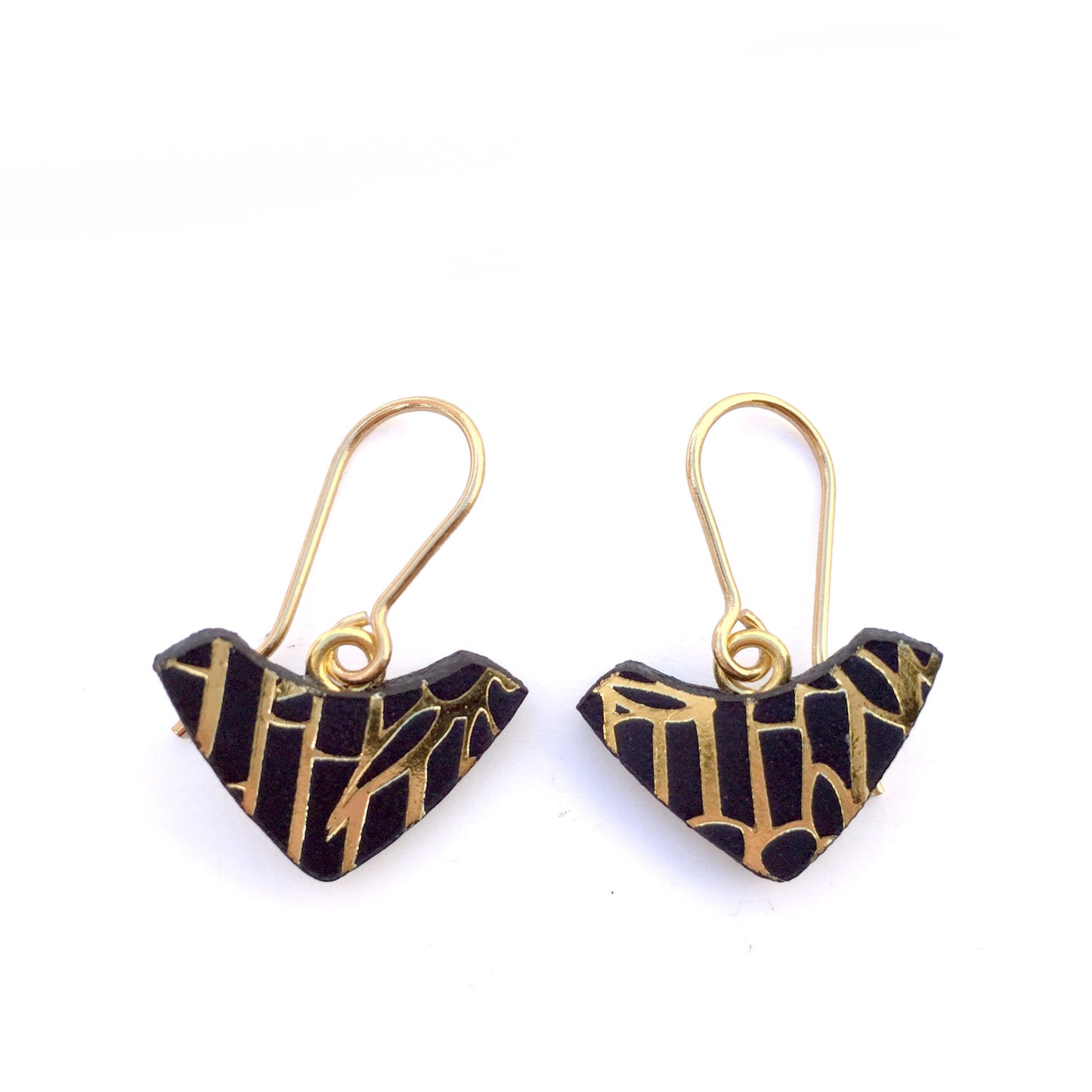 PRINTED LEATHER ARC . hook earrings