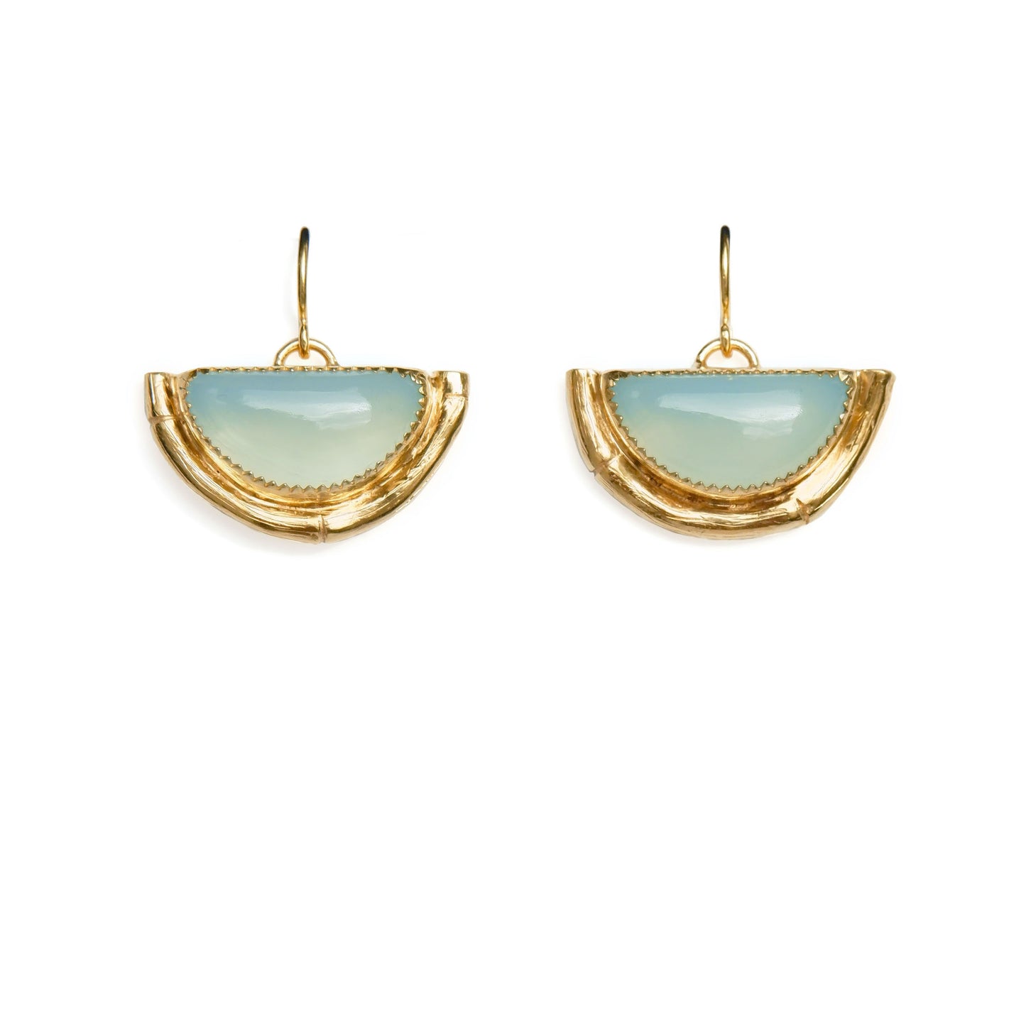 Earrings featuring half moon shaped semi precious aqua blue chalcedony gemstones,  cupped by solid silver bamboo hammock, plated in gold vermeil, with simple wire ear hooks.