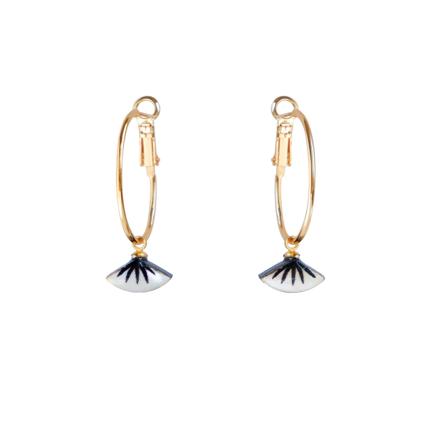 small gold hoop earrings with black spiky palm design on mother of pearl.