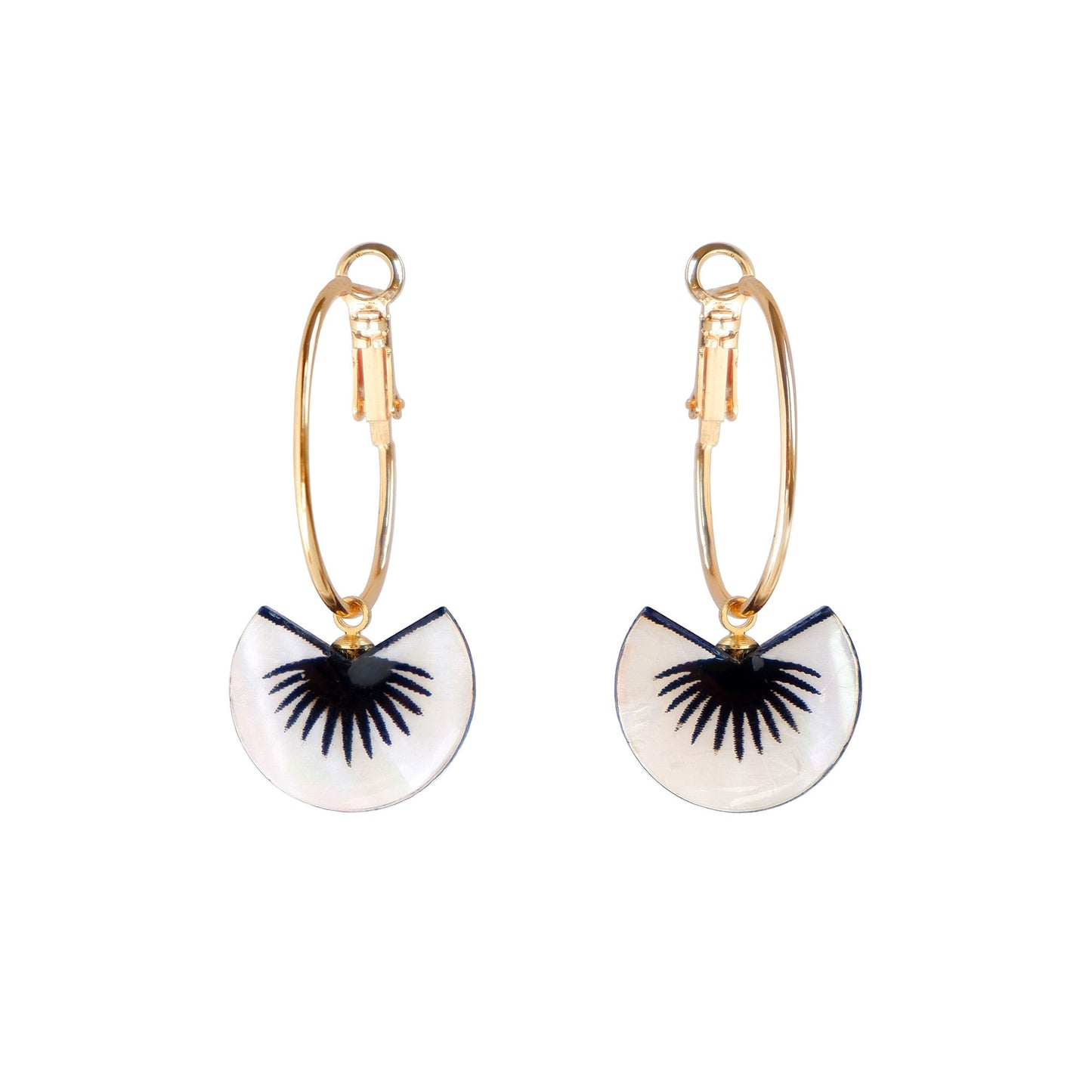 graphic black & mother of pearl spiky palm leaf design pendants on gold hoop earrings