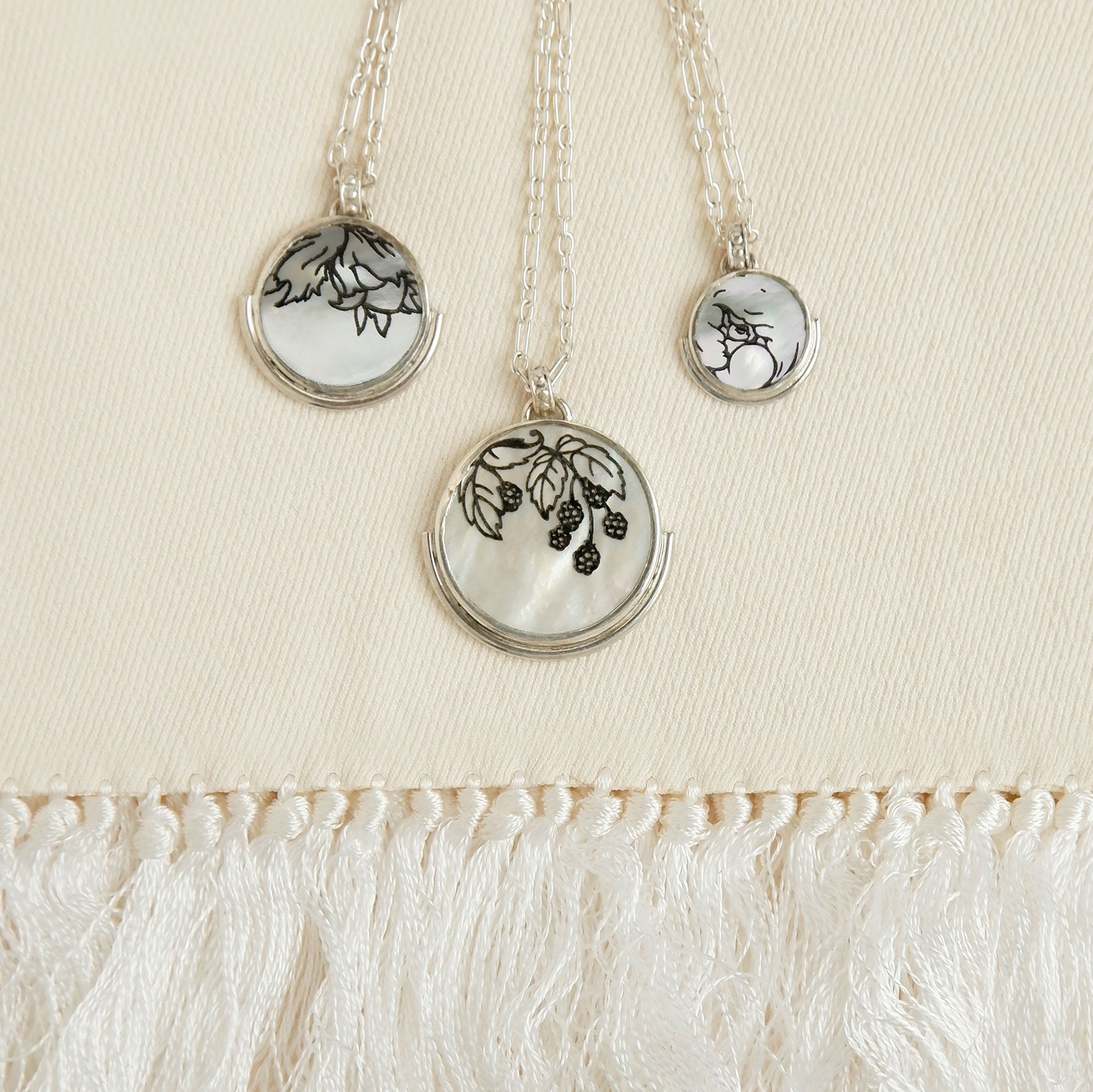 3 sizes of engraved mother of pearl full moon medallion pendants on silver chain