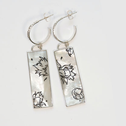 dotted sterling silver hoop earrings with large rectangular drop pendants in Mother of pearl, engraved with graphic botanical cobnut design