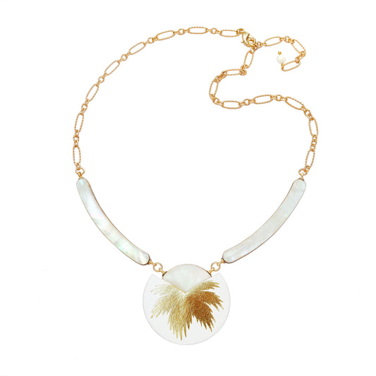 necklace with curved mother of pearl bars , leather medallion with a gold palm print