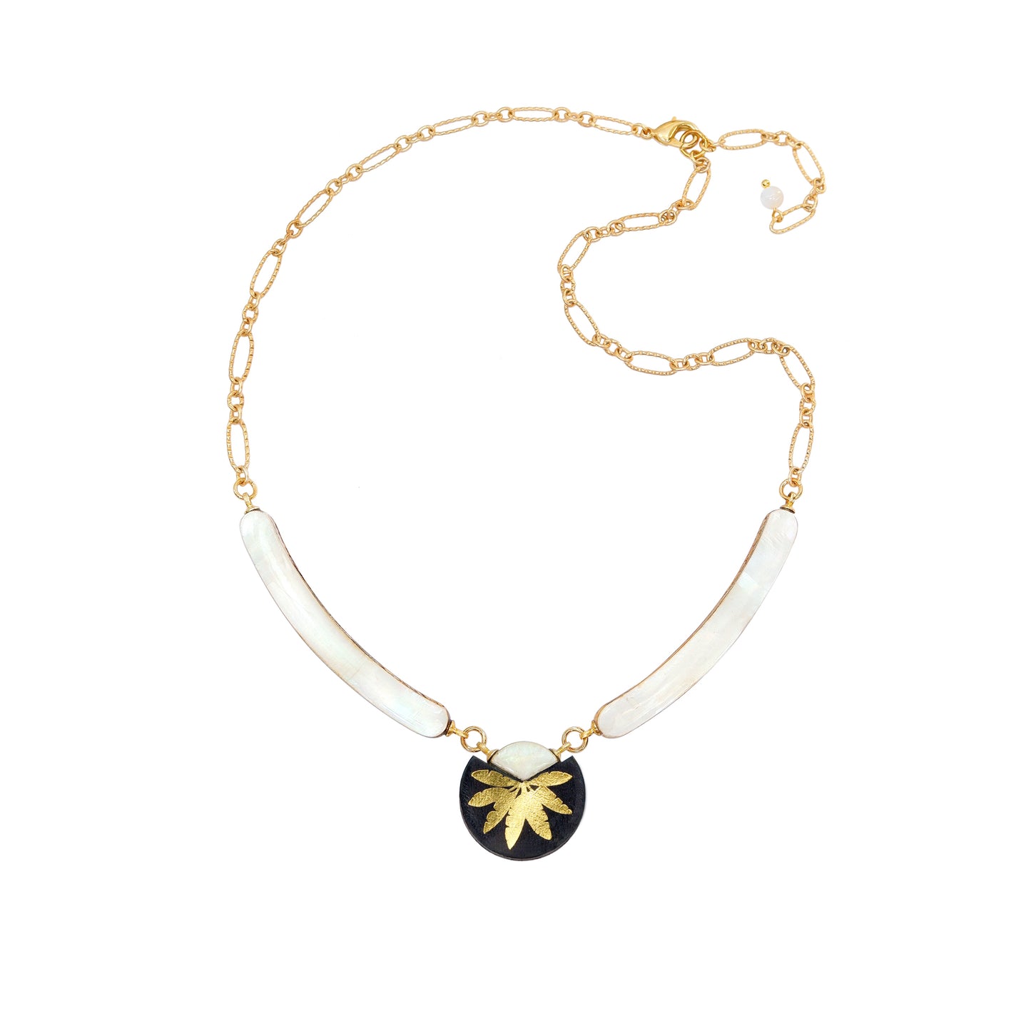 necklace with curved mother of pearl bars , black leather medallion with a gold palm print