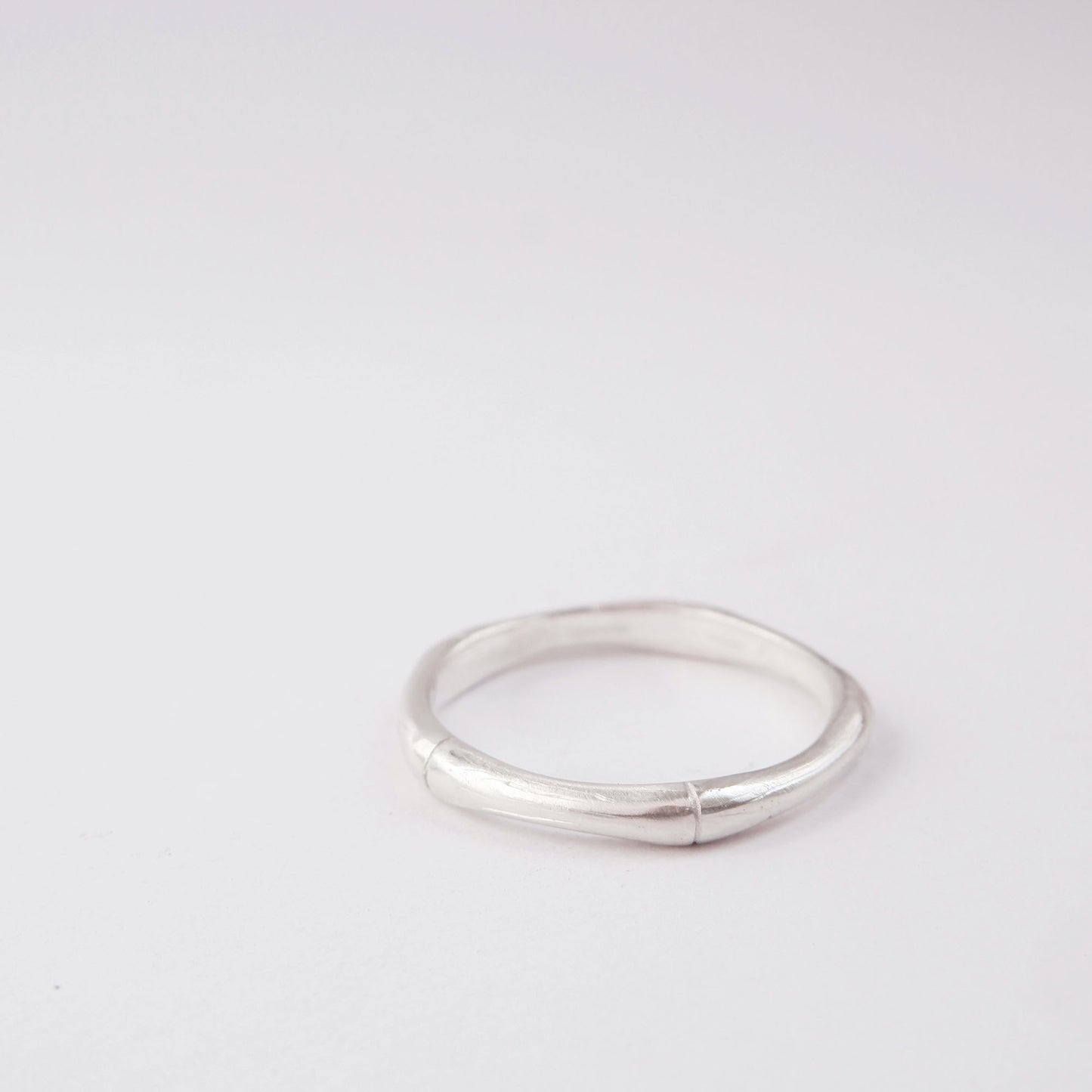 Sterling silver bamboo style stacking ring, on white background