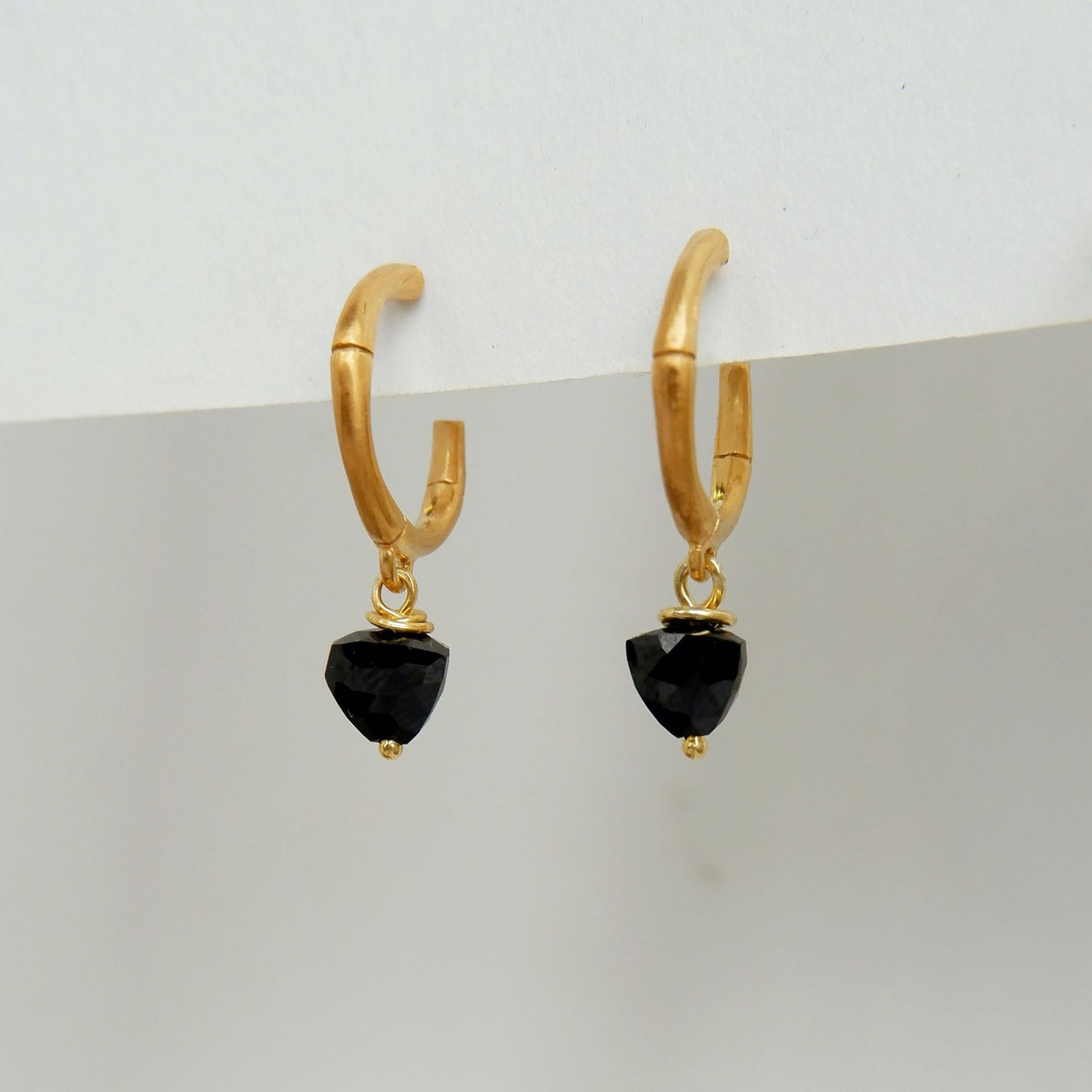 small gold bamboo hoops, with faceted trillion pyramid black onyx bead charm