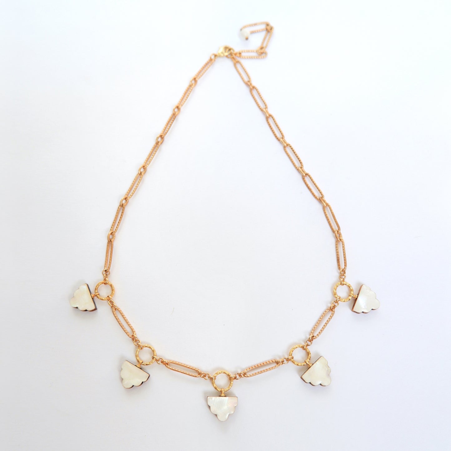 long-link gold chain charm necklace, with  deco cloud charms in mother of pearl