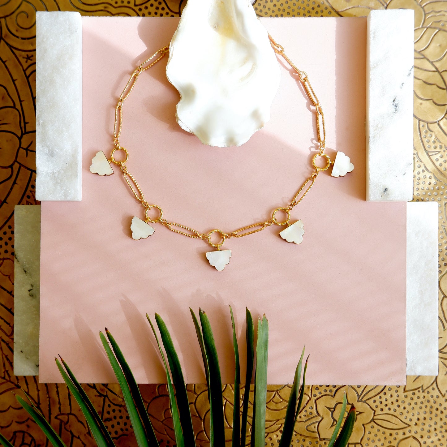 long-link gold chain charm necklace, with  deco cloud charms in mother of pearl