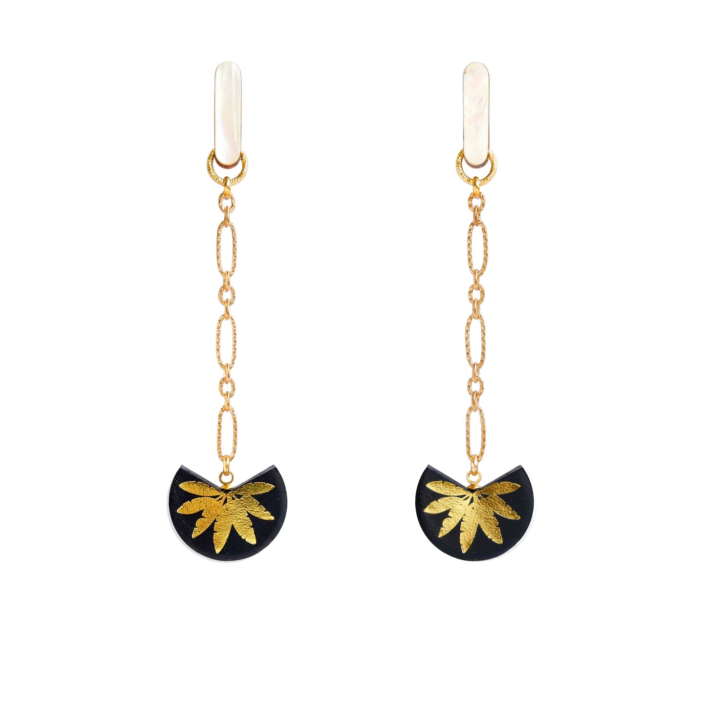 palm tree drop earrings. black leather medallions with gold palm print, on longl-link chain from long mother of pearl studs