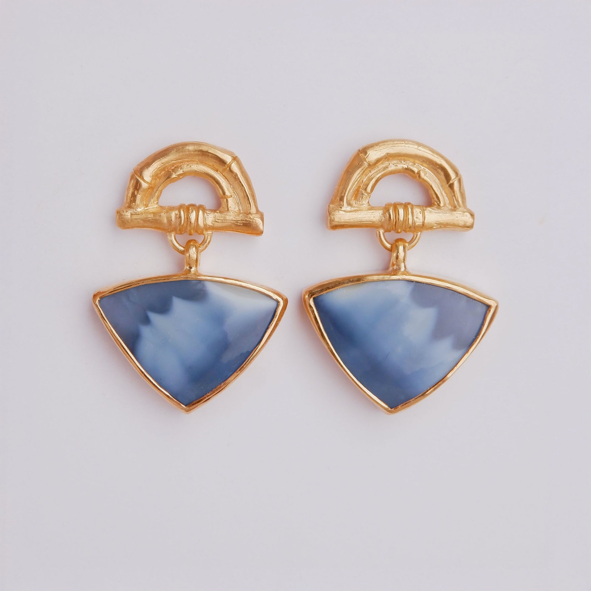 Gold Vermeil stud earrings featuring bamboo sunrise arch design, with gemstone drop pendants in marbled deep sky blue opal