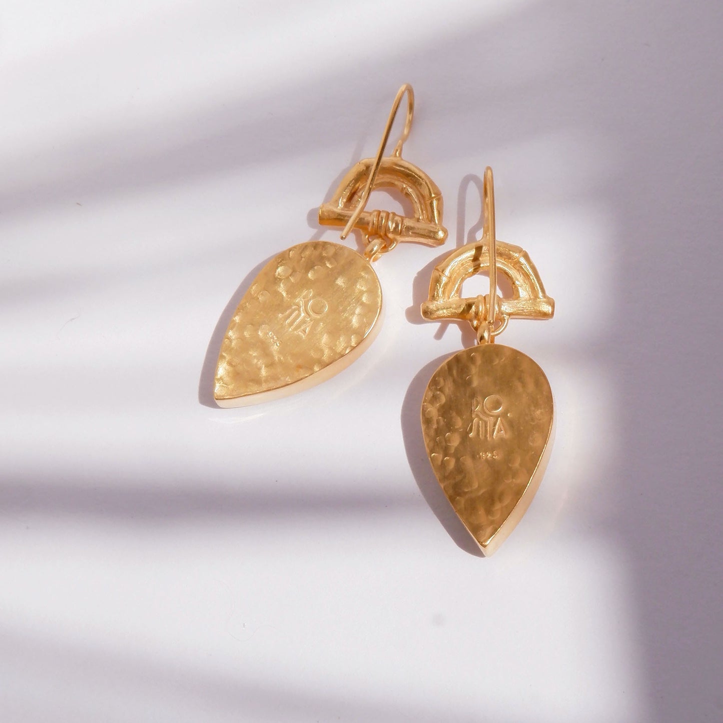 Gold Vermeil hook earrings featuring bamboo sunrise arch design, with pointed drop pendants, shown from back
