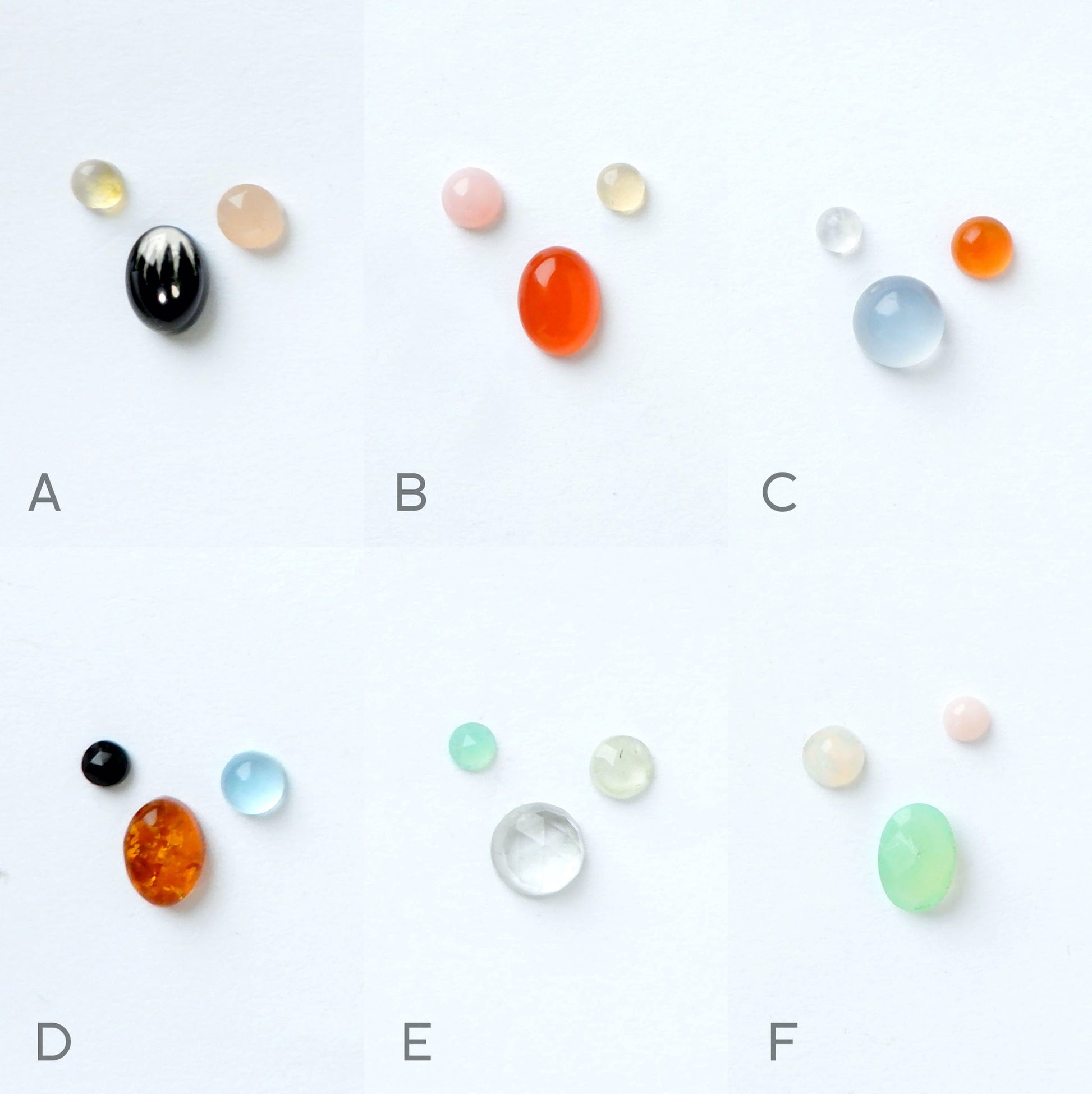 photograph of 9 sets of gemstones - the colour options for bombelli half moon squirrel drop earrings