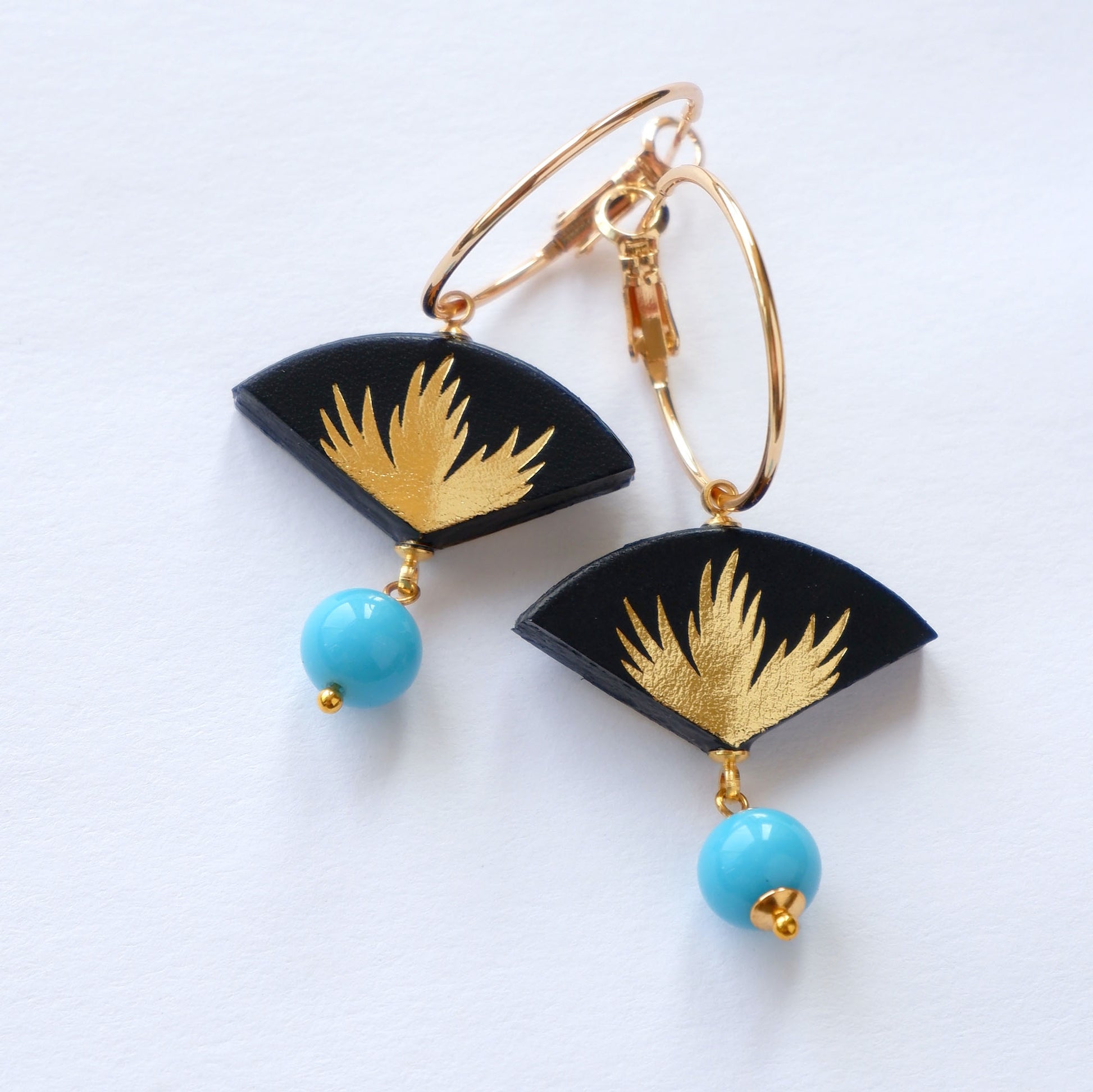black & gold palm print leather gold  hoop earrings with blue bead