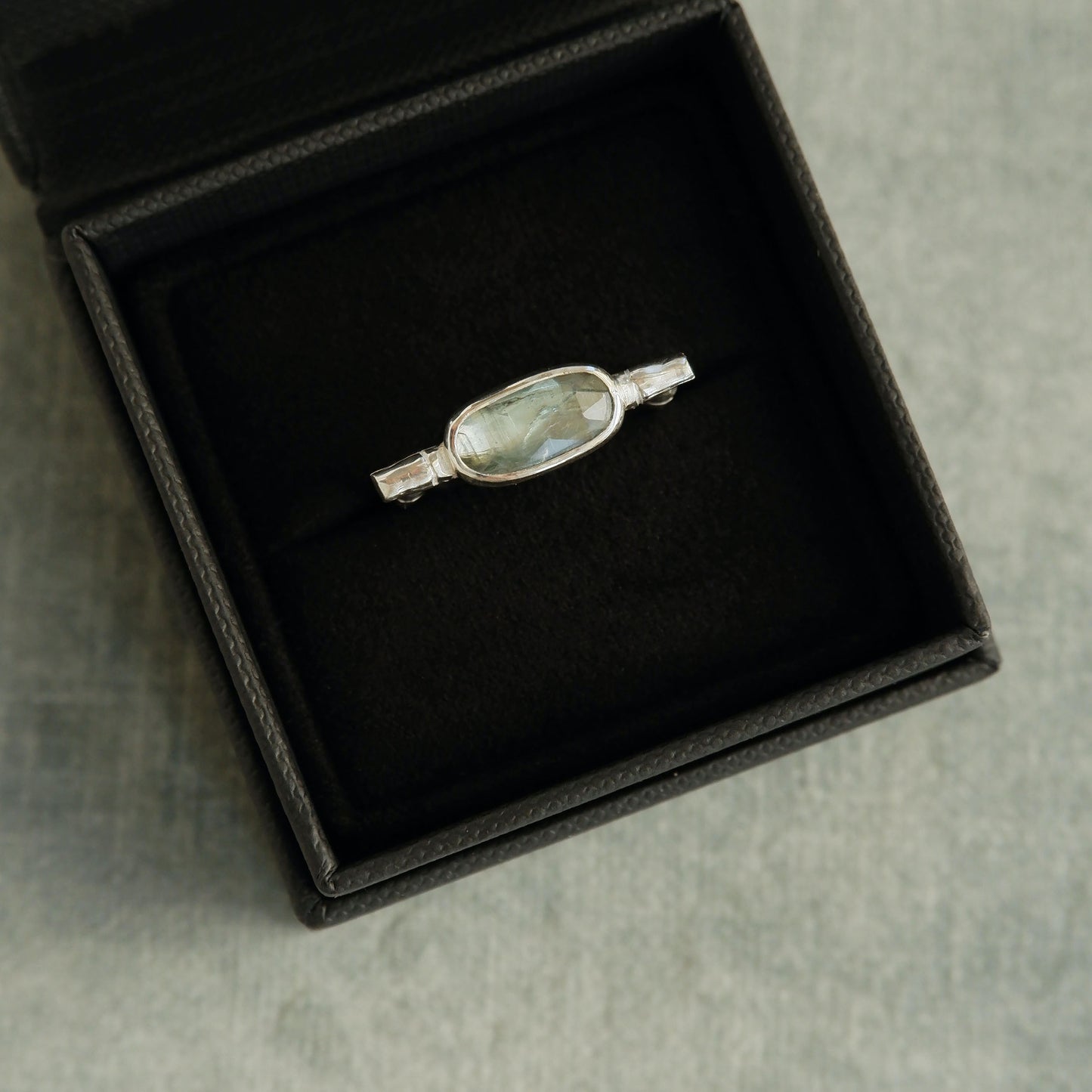 sterling silver organic bamboo cane ring, set with pale mint green kyanite cabochon, in box