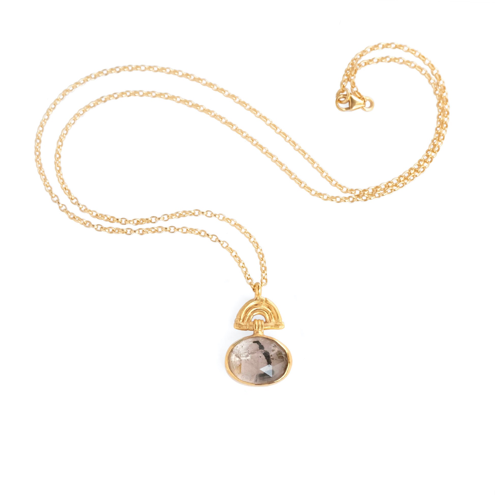 Pendant with oval Tourmalated Rose Quartz Gemstone hanging from a small gold Bamboo Arch, on fine gold chain. white background