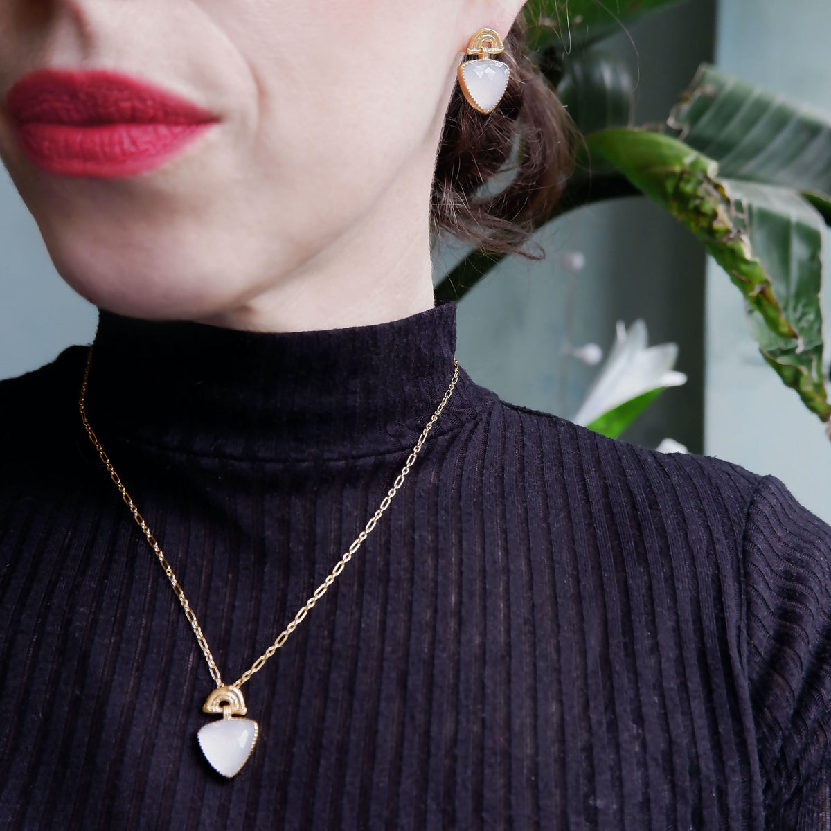 Gold Vermeil stud drop earrings , featuring triple arches of bamboo, paired with a hanging faceted Trillion shaped Lavender Chalcedony gemstone charm pendant, set with serrated gold teeth. Shown on model with matching pendant