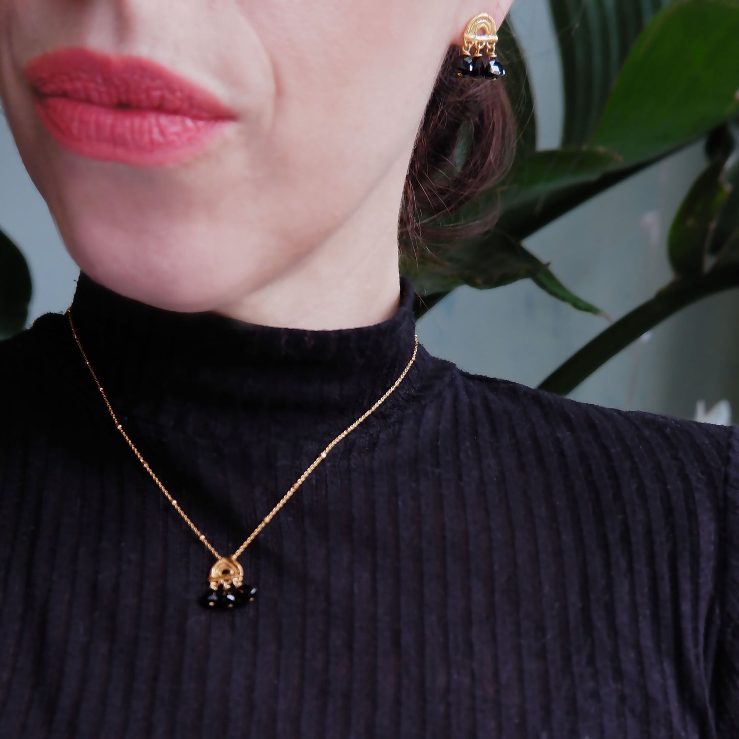 small stud earrings in Gold Vermeil, featuring a triple arch of bamboo, hung with Pyramid Trillion Beads in Black Onyx