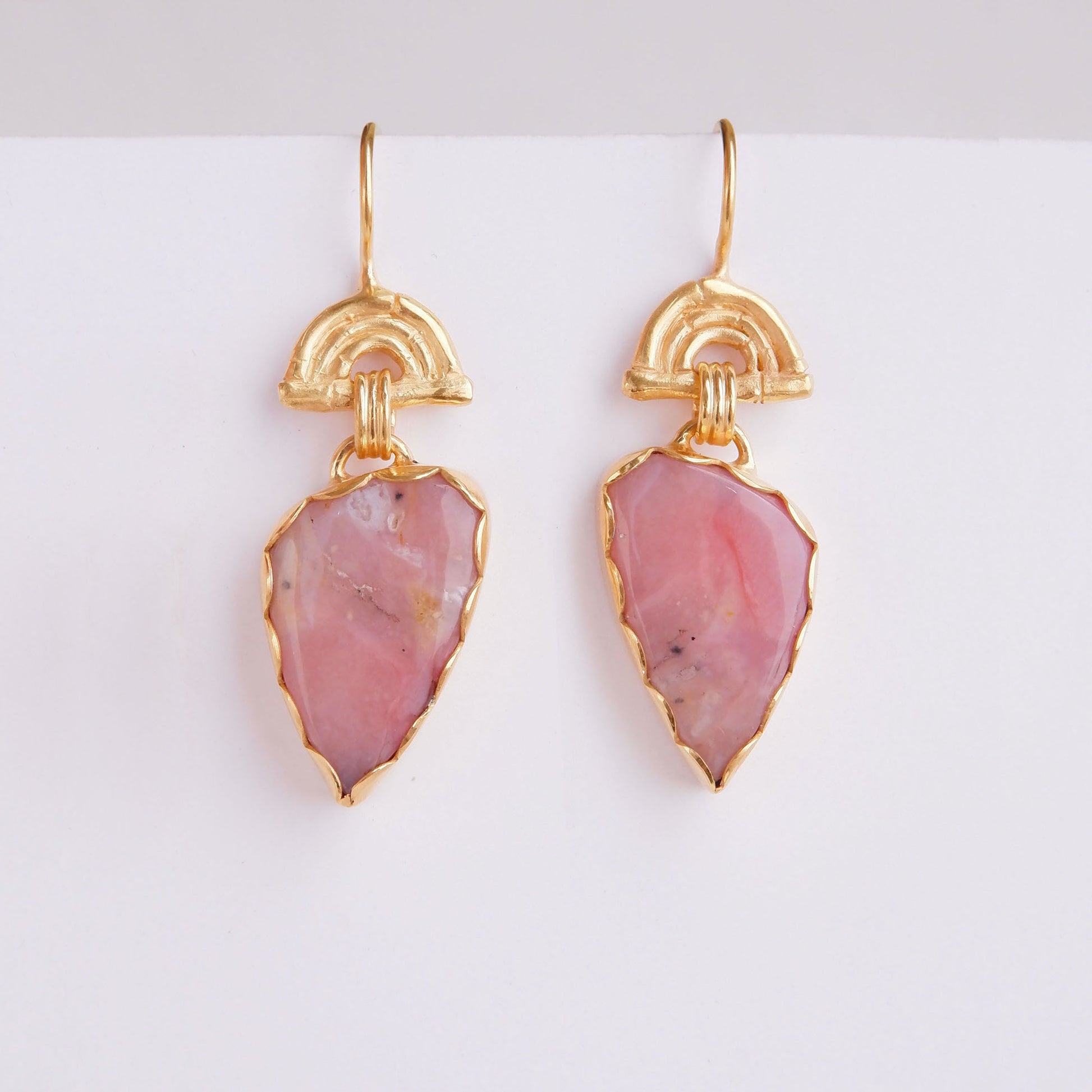 drop earrings in gold vermeil, featuring triple arches of bamboo on hooks, hung with pear/teardrop shaped pink opal gemstone pendants