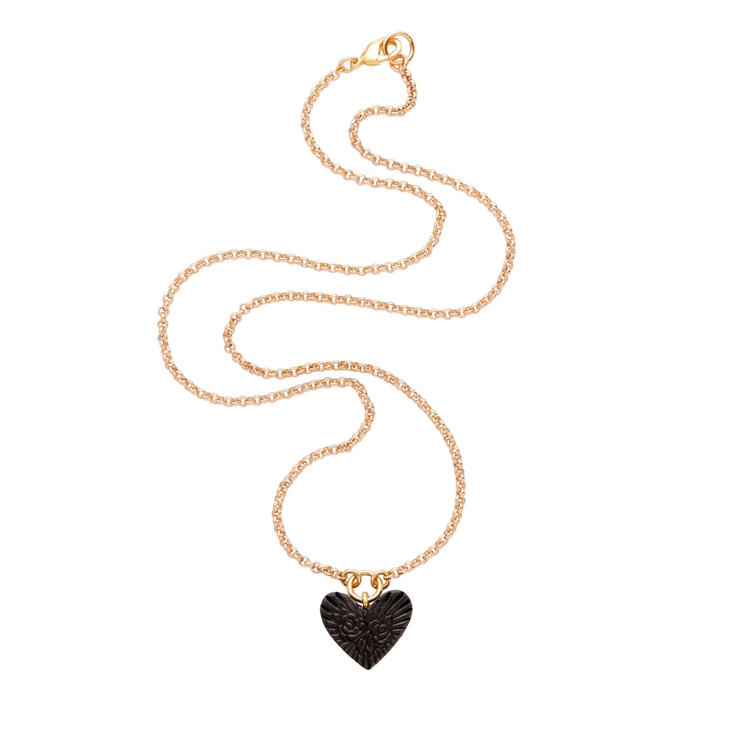 small Black Leather Heart pendant; embossed with a  rose & rays design, on fine gold-plated belcher chain.