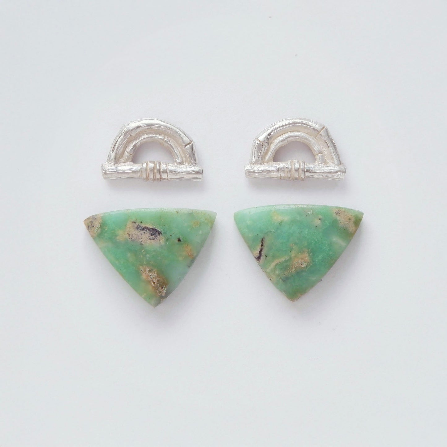 Sterling Silver bamboo sunrise arch design earring tops, with pointed gemstone cabochons in marbled green Chrysoprase