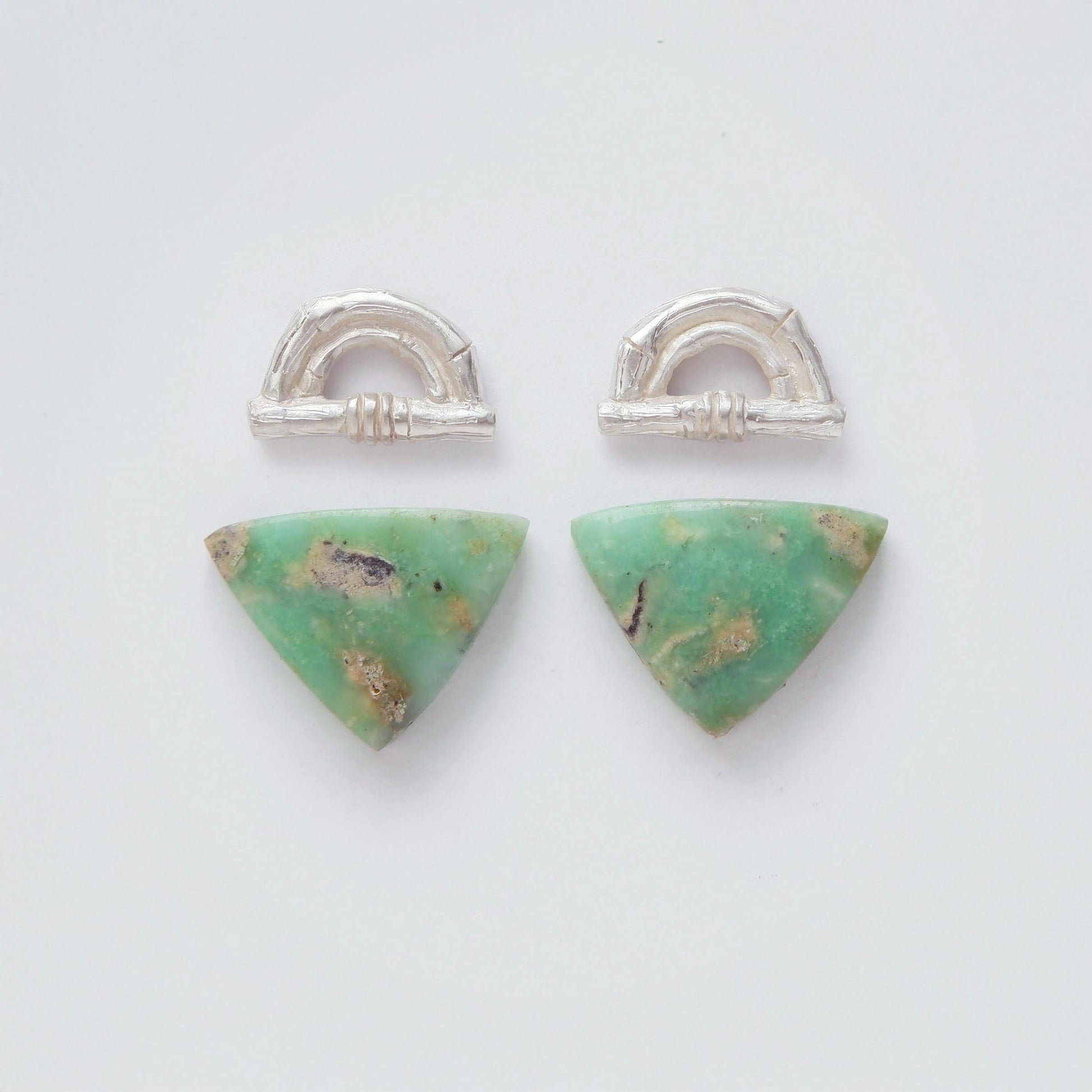 Sterling Silver bamboo sunrise arch design earring tops, with pointed gemstone cabochons in marbled green Chrysoprase