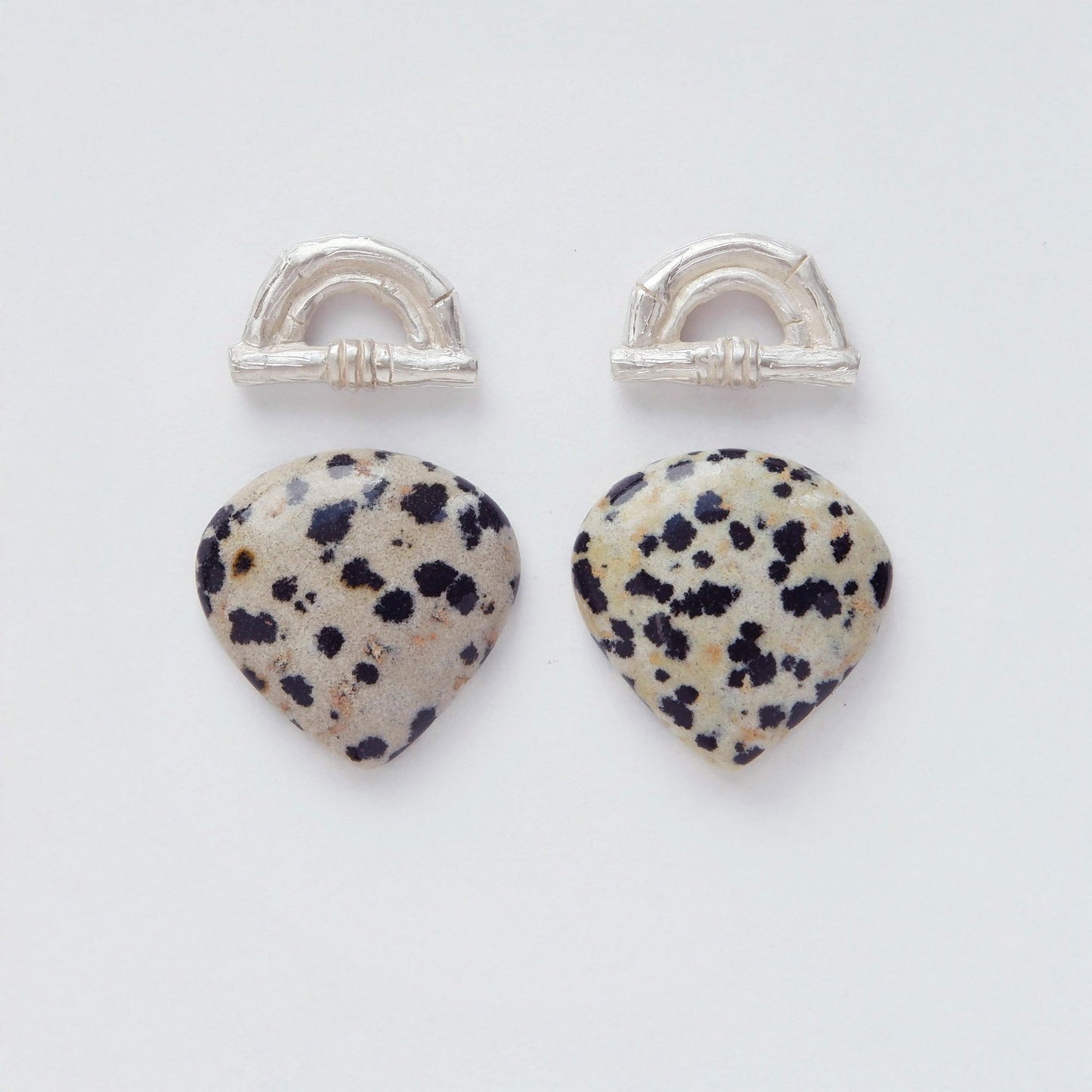 Sterling Silver bamboo sunrise arch design earring tops, with pointed gemstone cabochons in speckled Dalmatian Jasper 