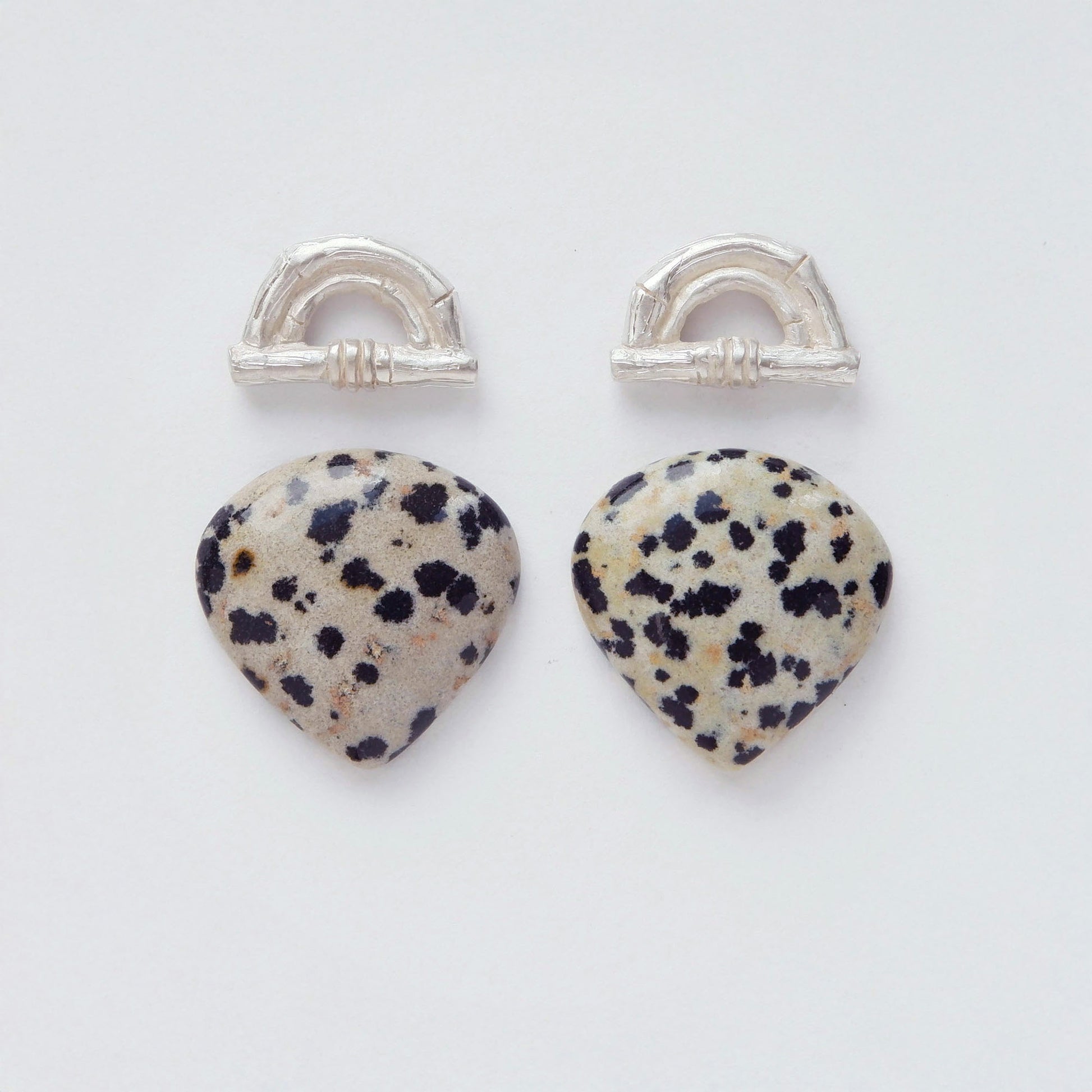 Sterling Silver bamboo sunrise arch design earring tops, with pointed gemstone cabochons in speckled Dalmatian Jasper 