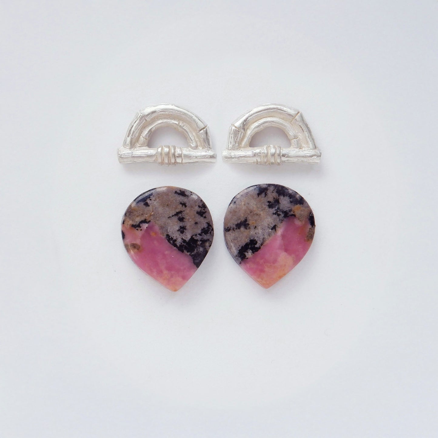 Sterling Silver bamboo sunrise arch design earring tops, with pointed gemstone cabochons in Pink, grey & black Rhodonite.