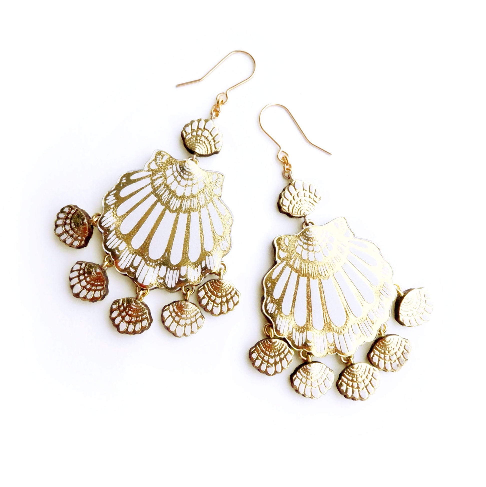 seashell chandelier earrings in white leather with gold printed detail.