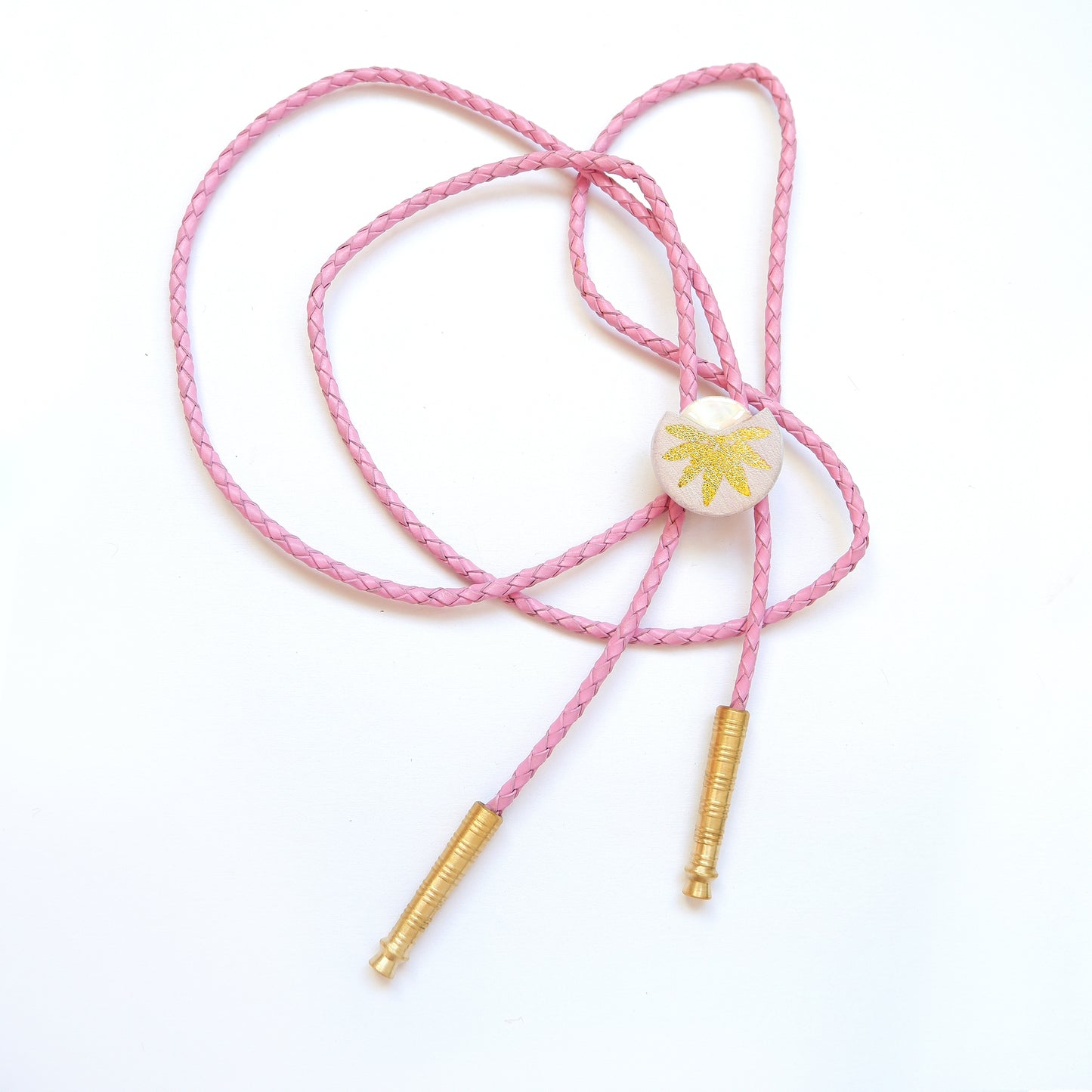 lilac leather bolo tie with gold palm print, mother of pearl accent & brass tips