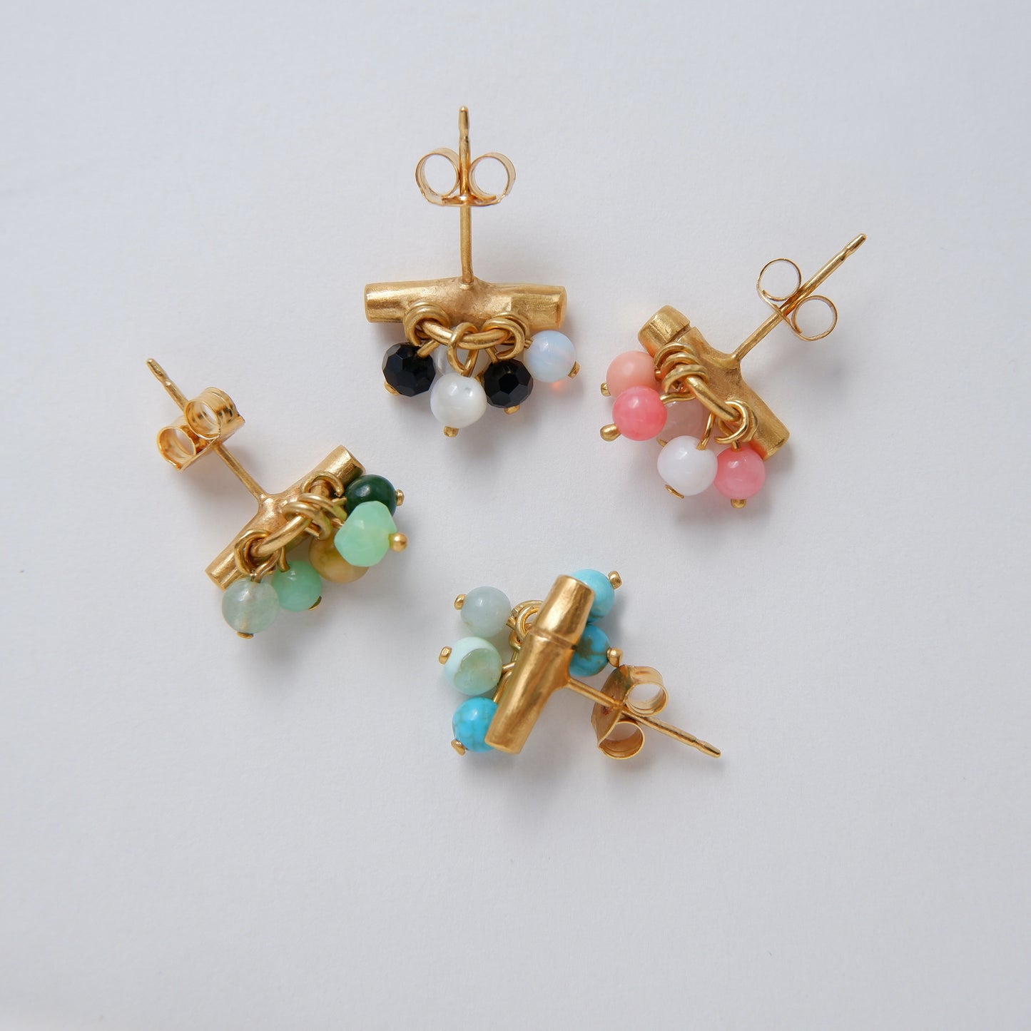 gold vermeil bamboo bar stud earrings with gemstone beads in green, pink, black & white, and green