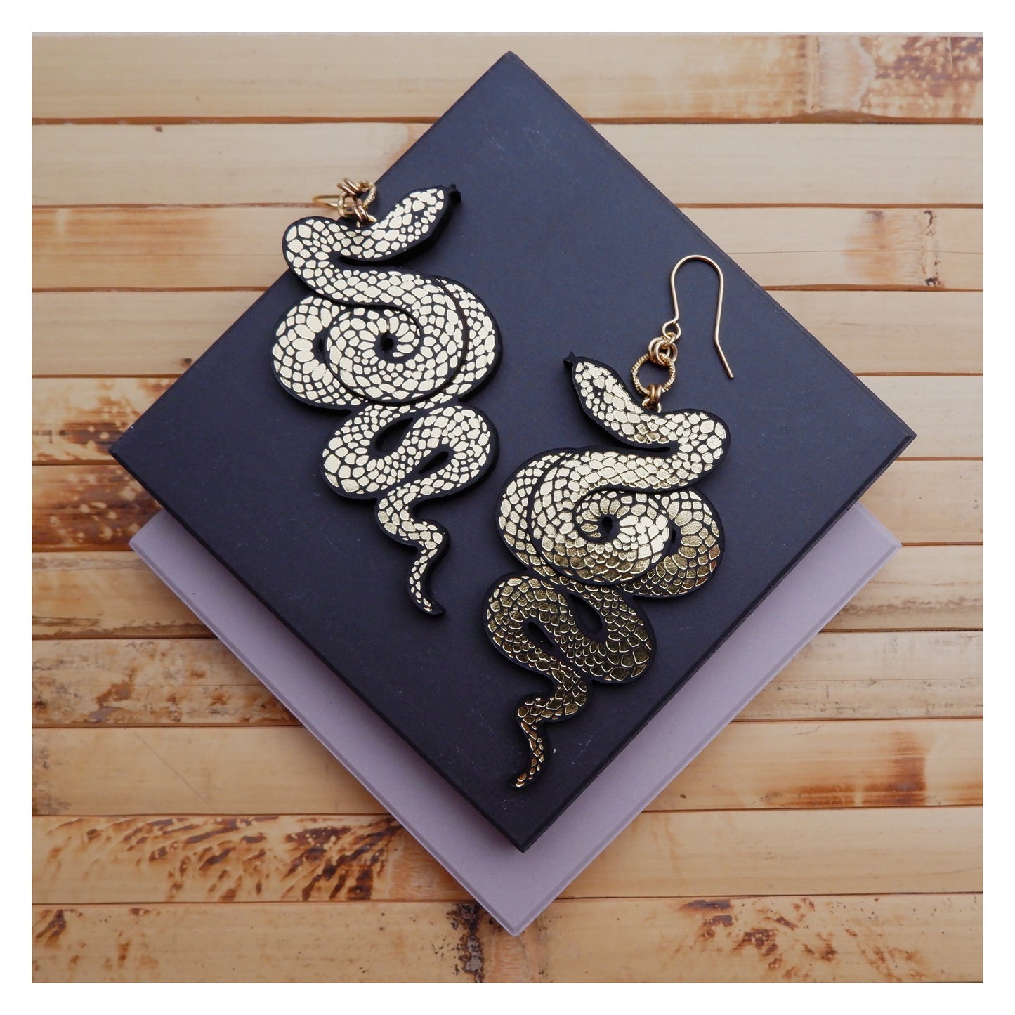 black & gold serpent earrings