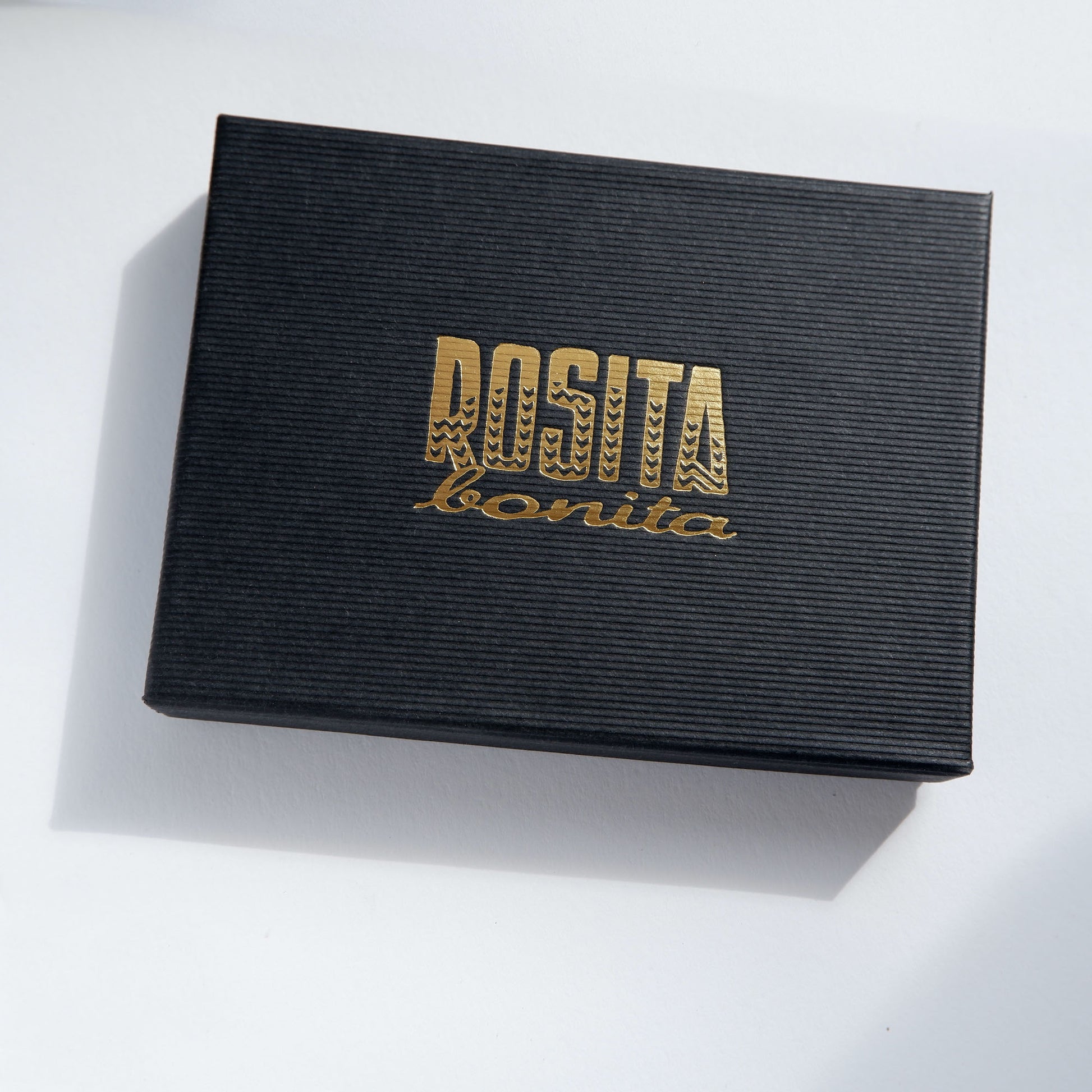 black cardboard box with Rosita Bonita log in gold