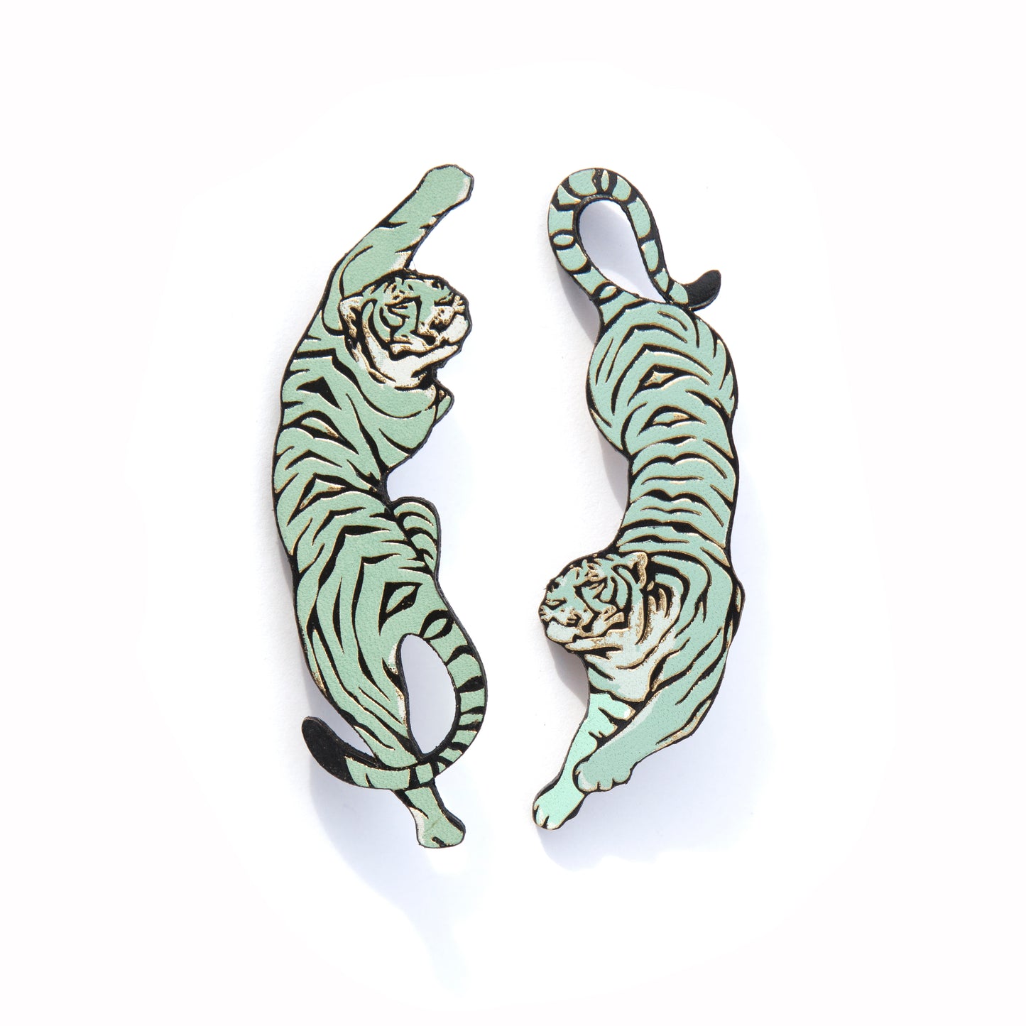 LEAPING TIGER . brooches