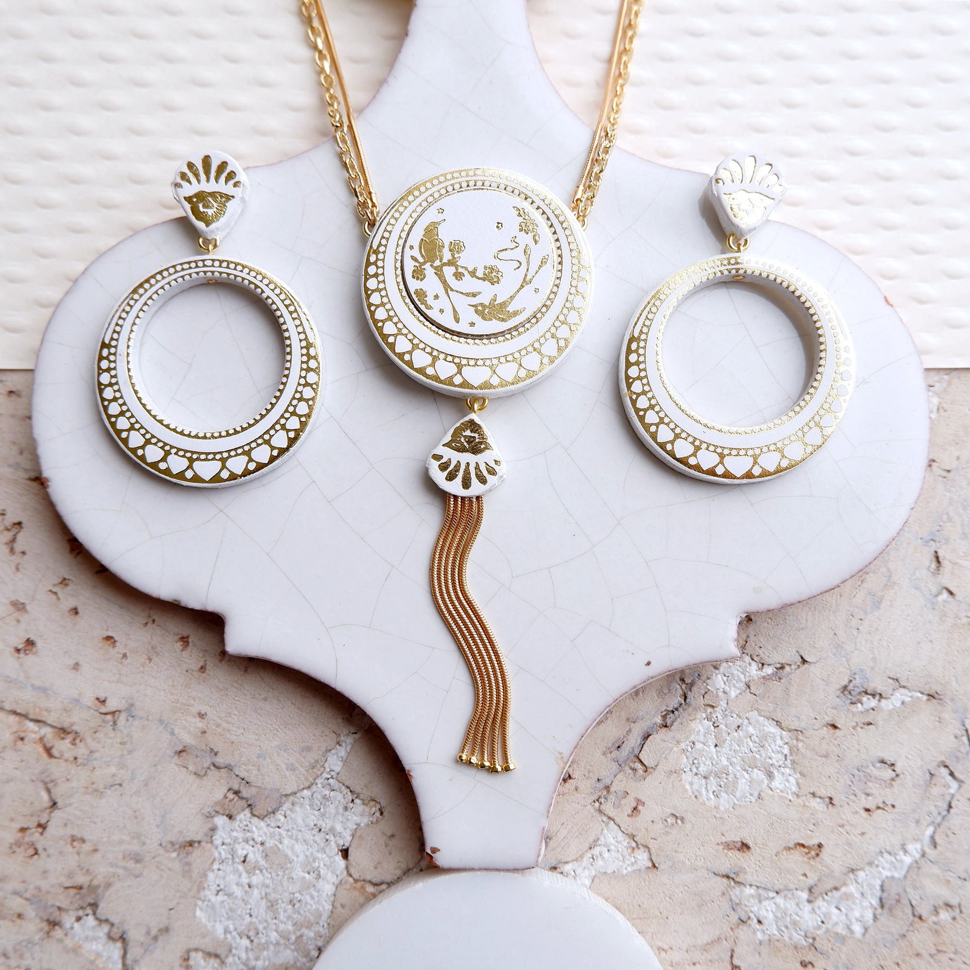 white & gold leather tasselled medallion necklace & matching hoops earrings