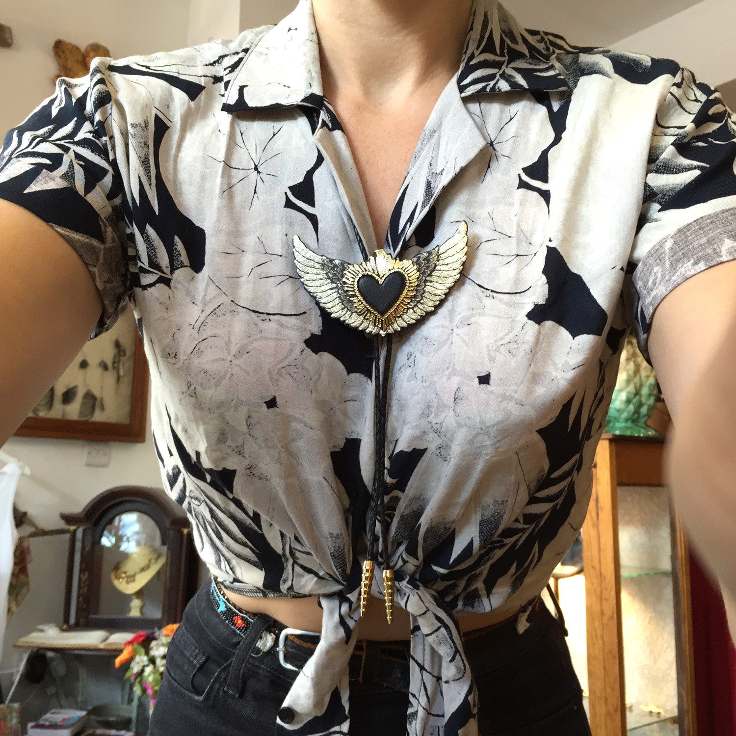 black winged sacred heart bolo in leather, omodelled on shirt
